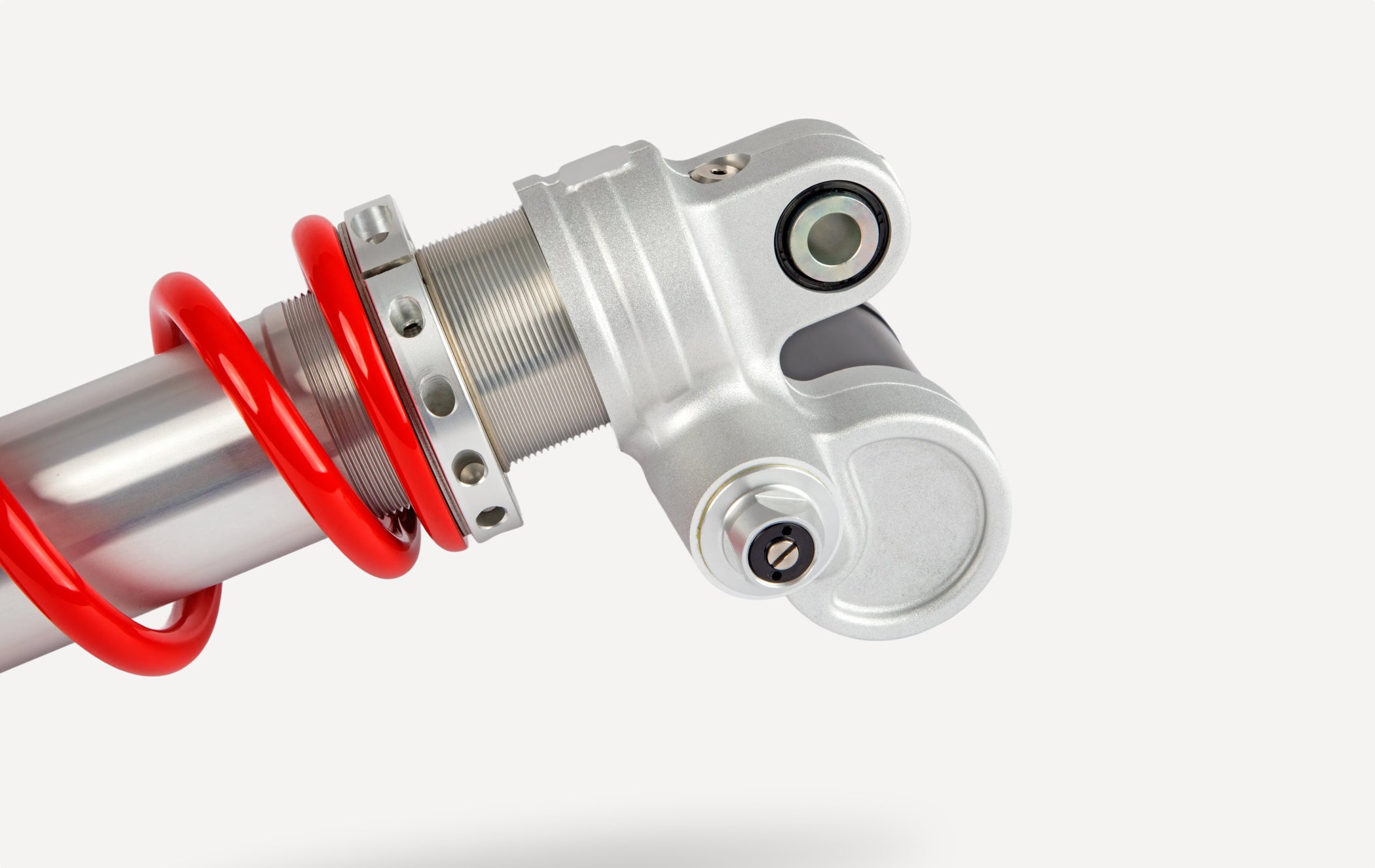Marzocchi rear shock absorber with red coil spring and adjustable aluminum mount