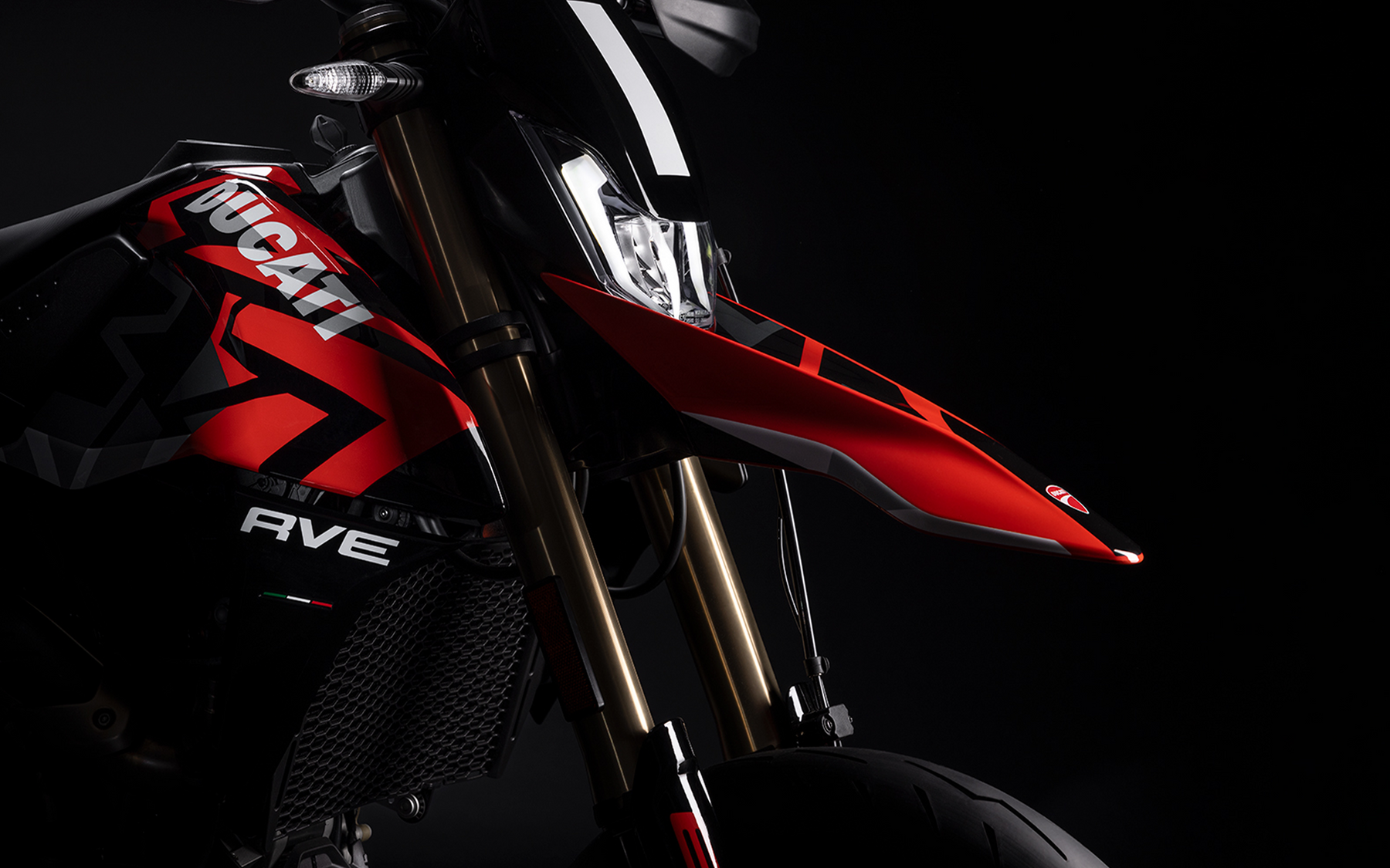Front view of Ducati Hypermotard motorcycle featuring gold inverted USD front forks and high-performance suspension system.