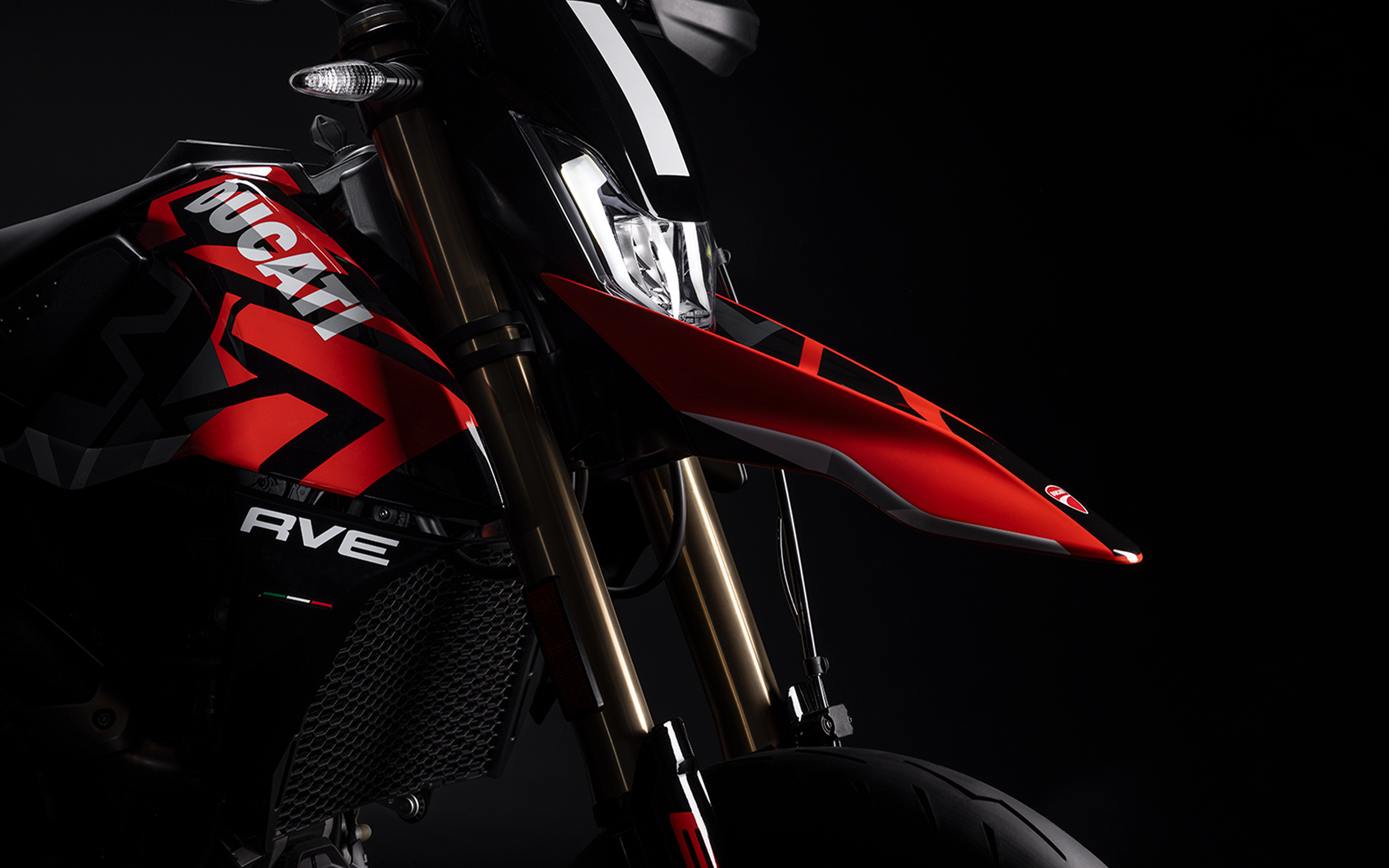 Front view of Ducati Hypermotard motorcycle featuring gold inverted USD front forks and high-performance suspension system.