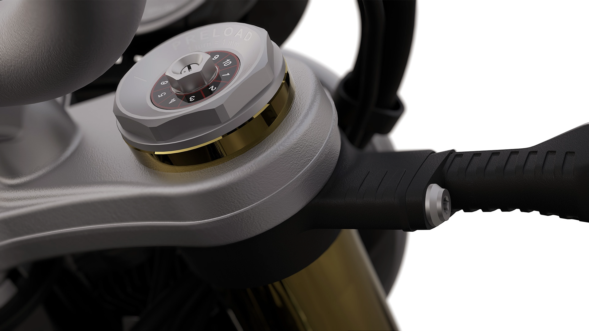 Motorcycle front fork preload adjuster dial with numbered settings for suspension tuning.
