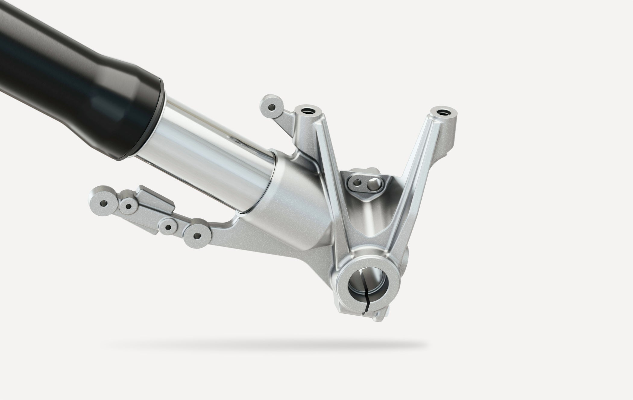 Close-up of a motorcycle suspension fork on a white background