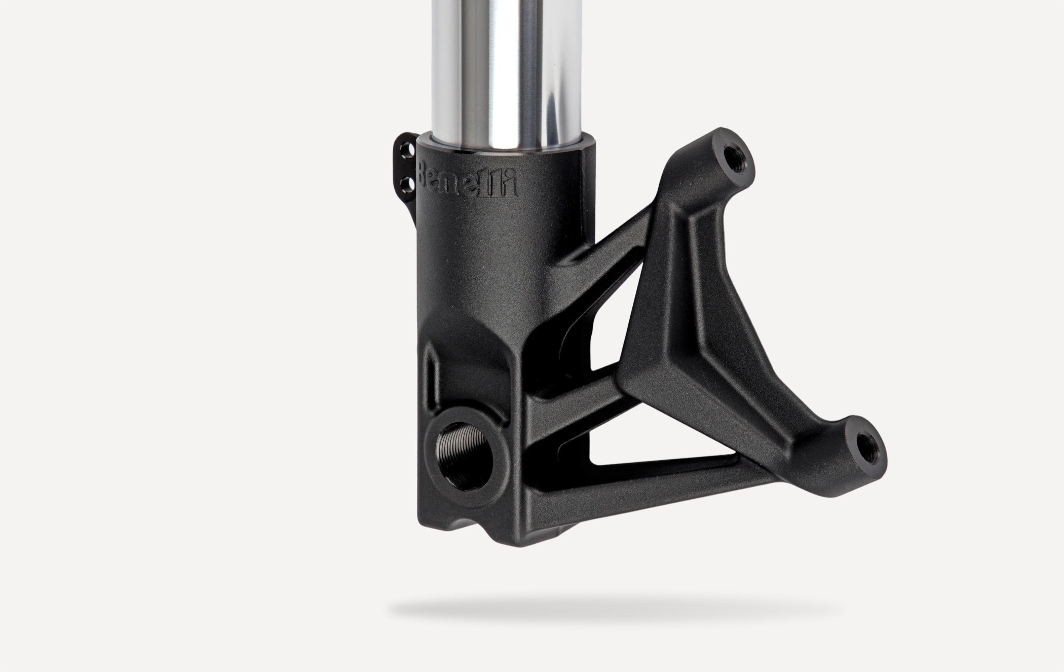 Benelli motorcycle front fork lower leg featuring integrated brake caliper mounting bracket and precision-machined suspension housing.
