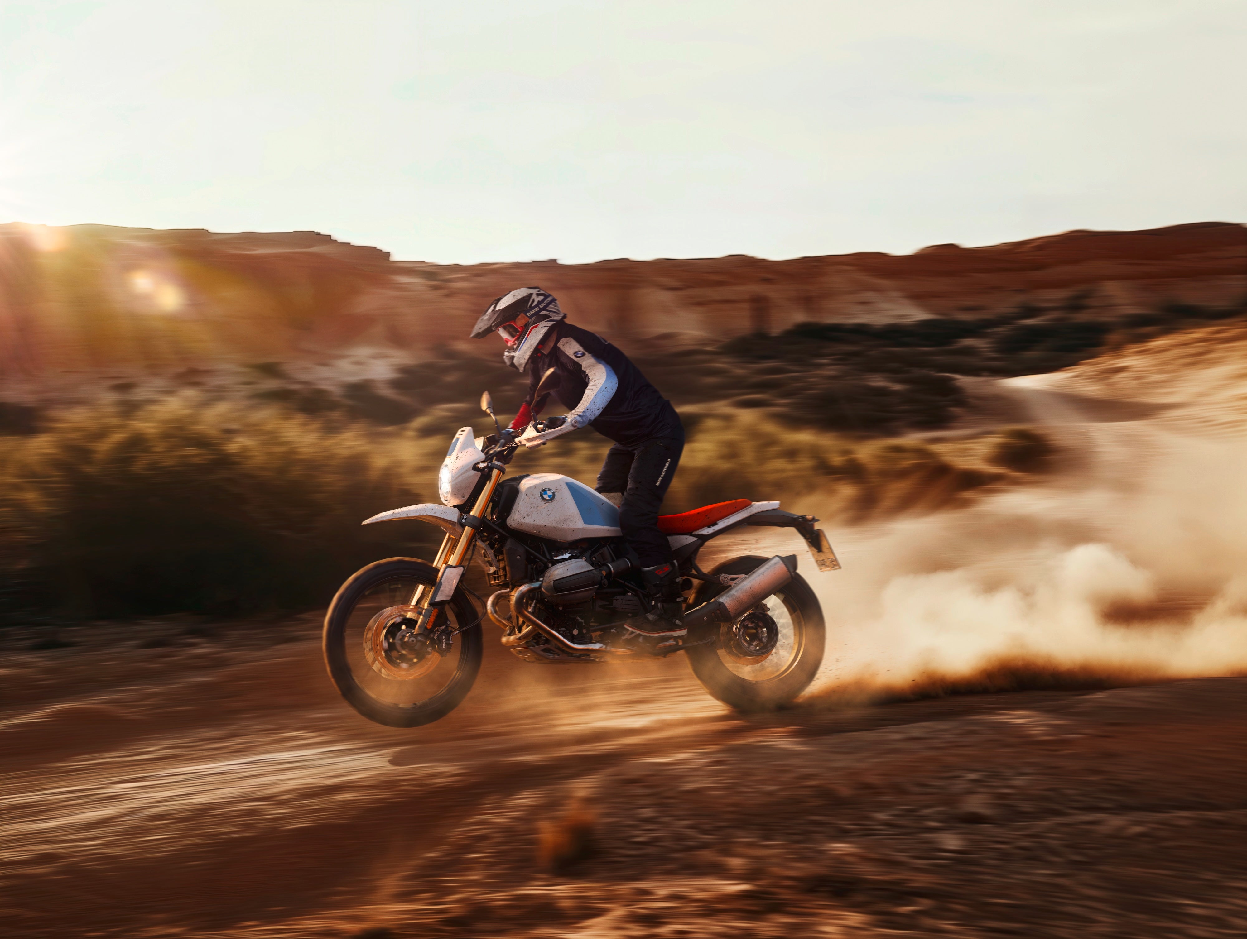 BMW R 12 G/S riding off-road through desert terrain, showcasing long-travel suspension and classic adventure performance.
